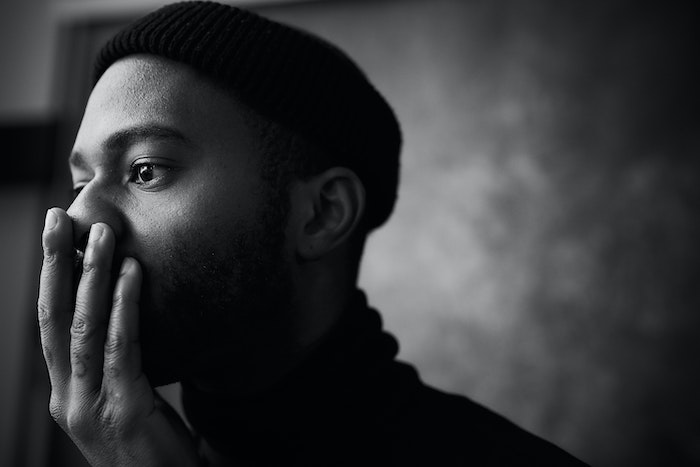 Pensive, handsome artistic black man thinking